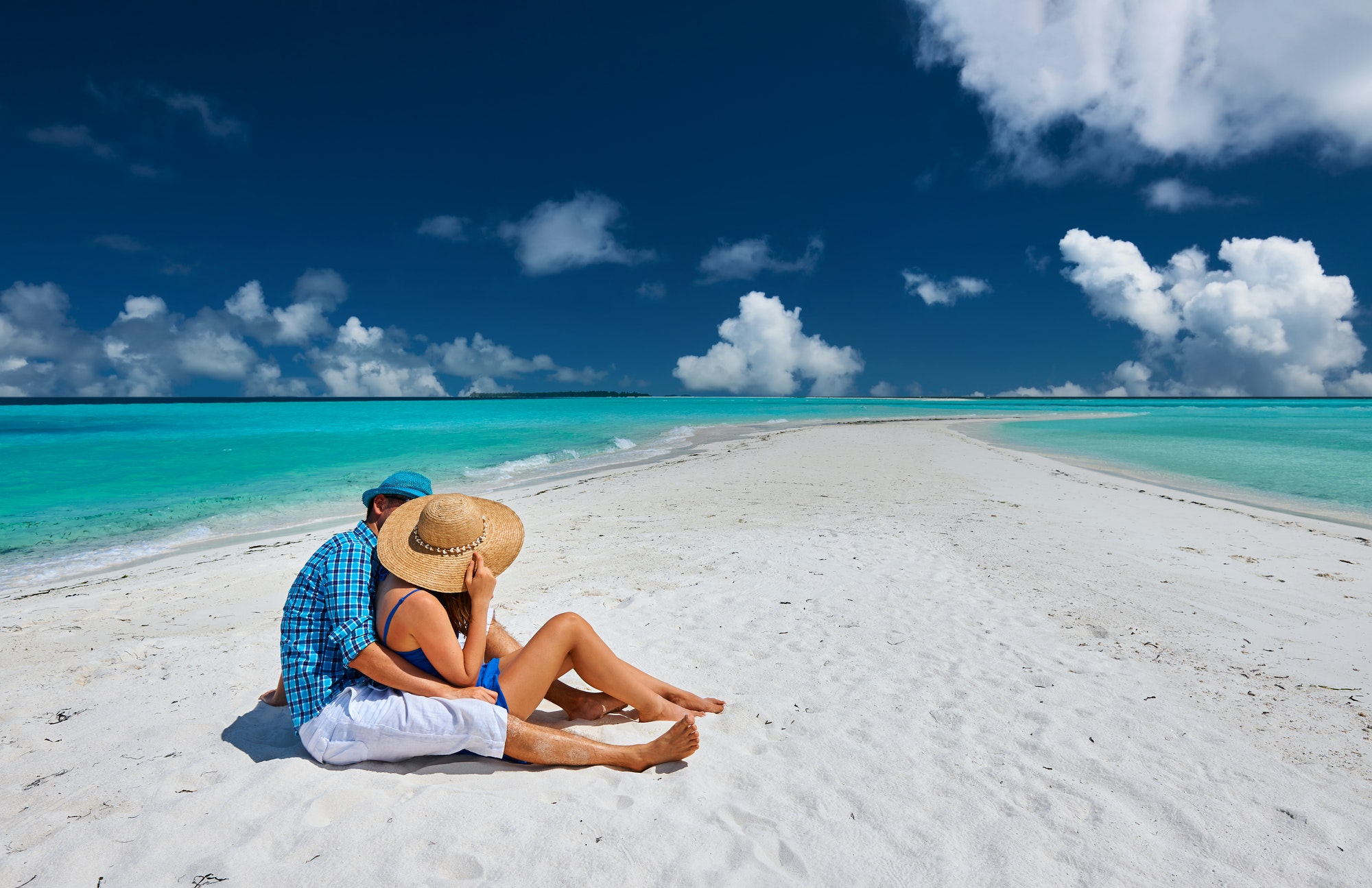 Couple in blue on a beach at Maldives